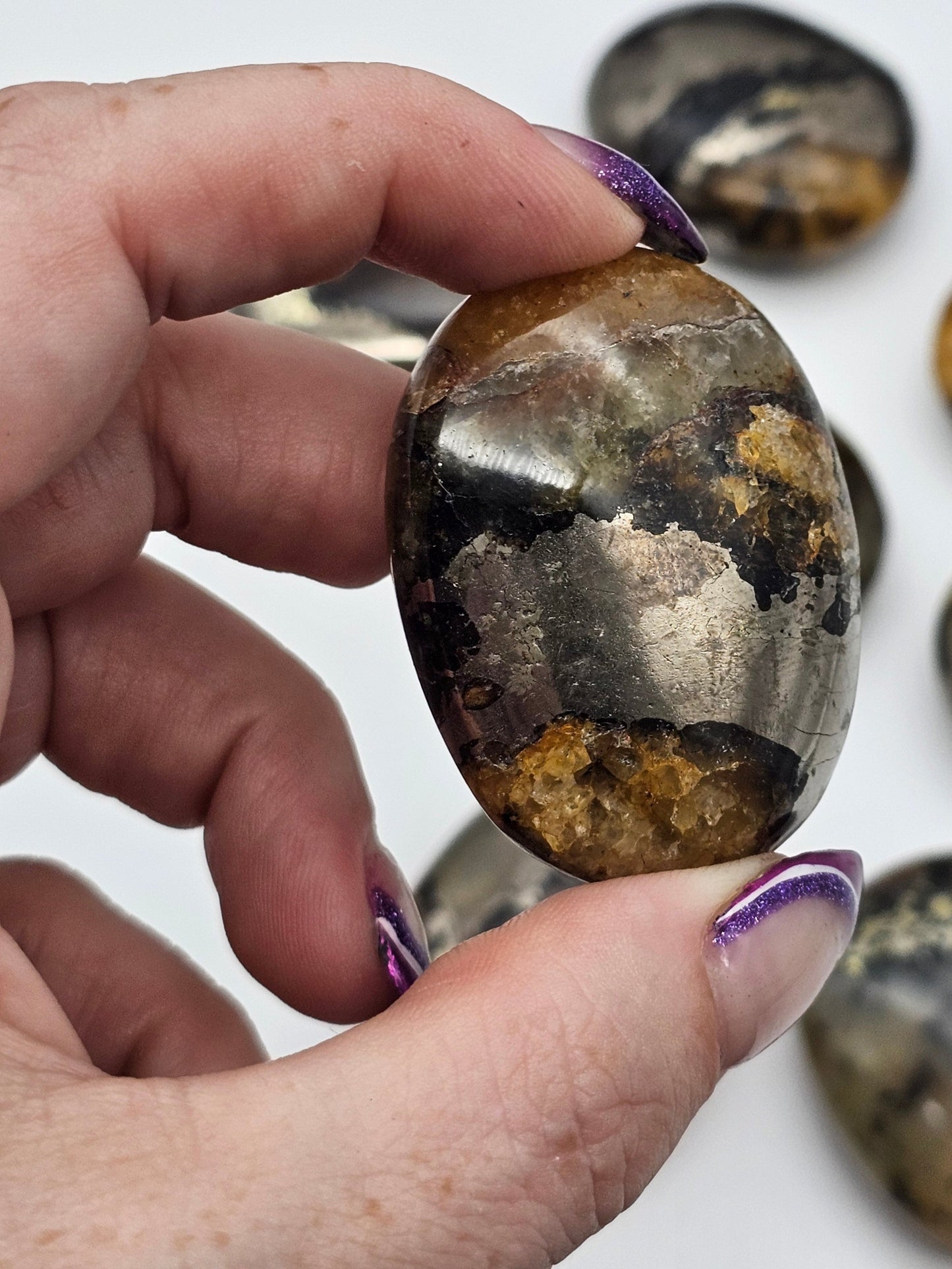 Golden Healer Quartz And Pyrite Palm Stones - detail shot