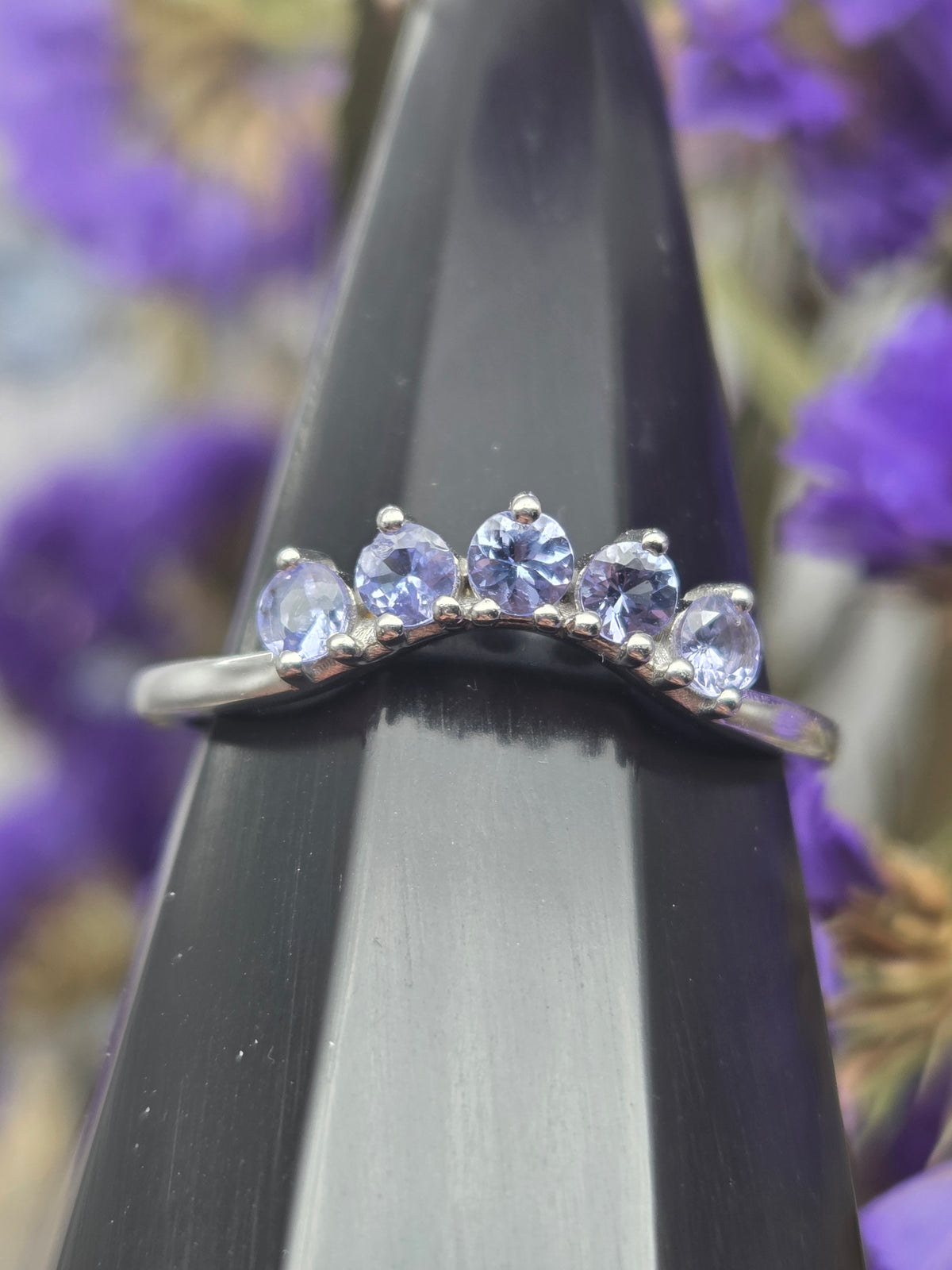 Faceted tanzanite ring with five stones