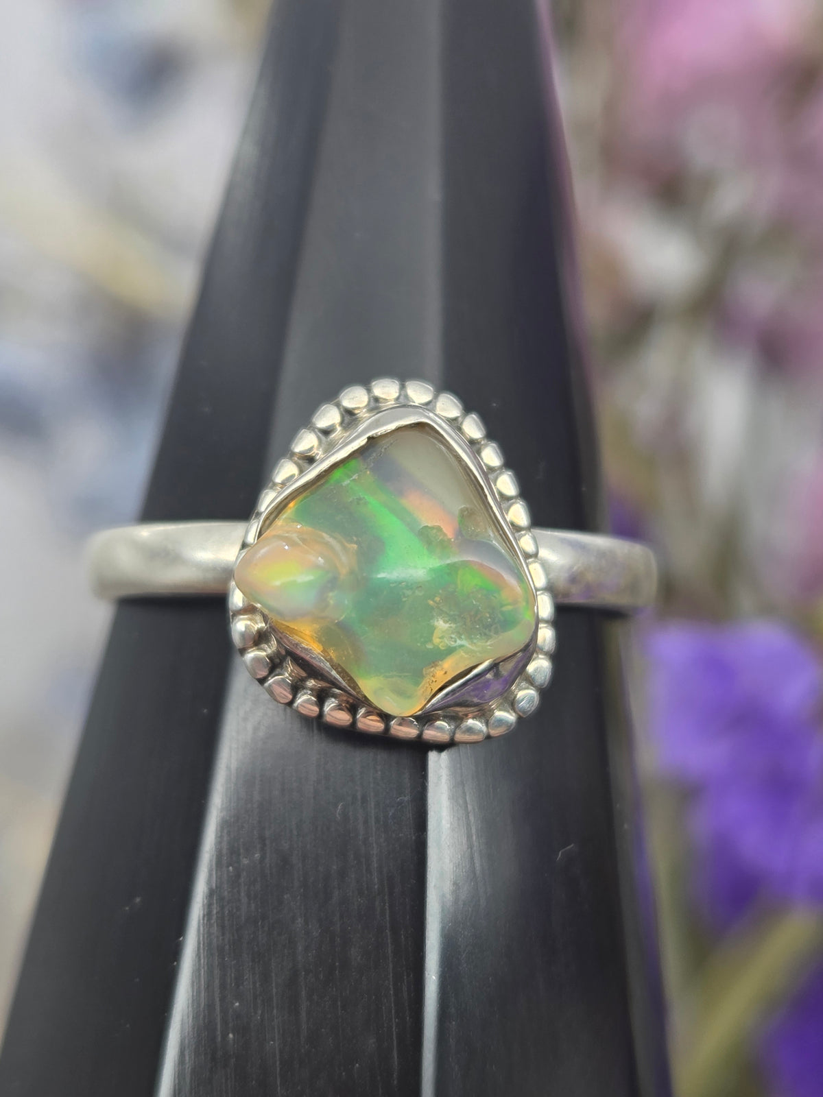 Ethiopian opal silver ring with green and orange hues