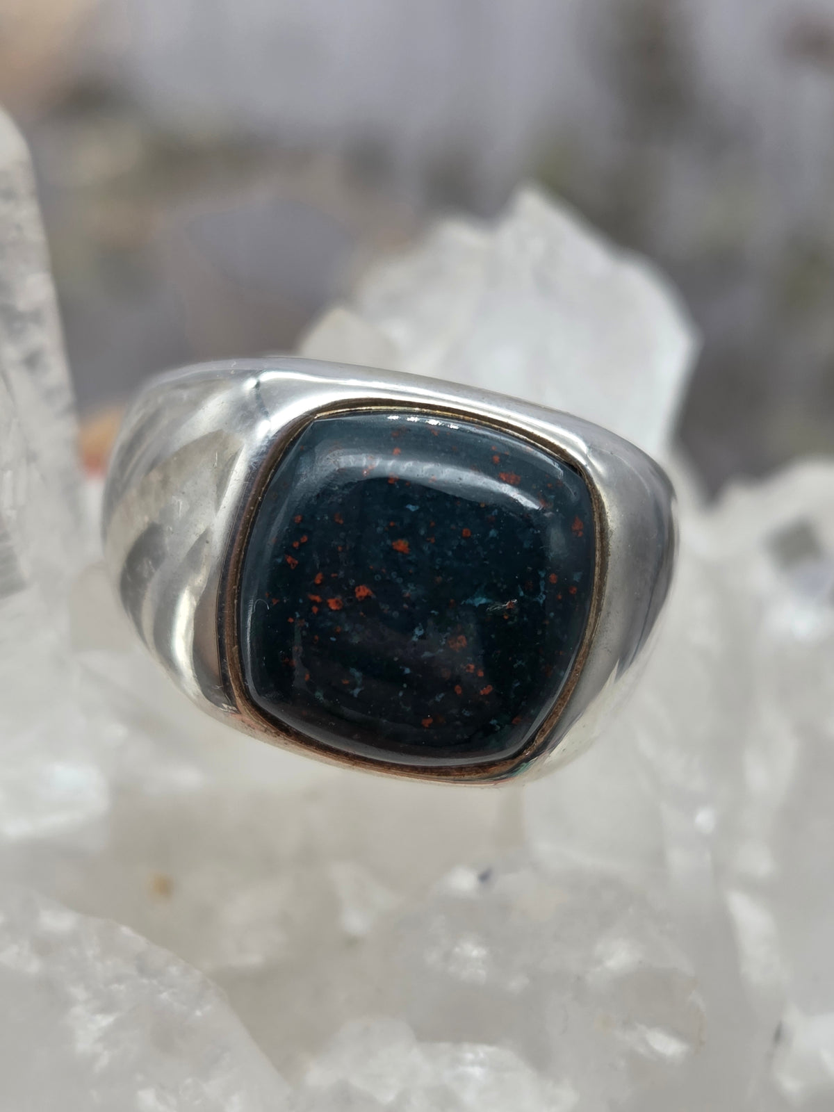 Bloodstone ring with dark green and red speckles set on a band