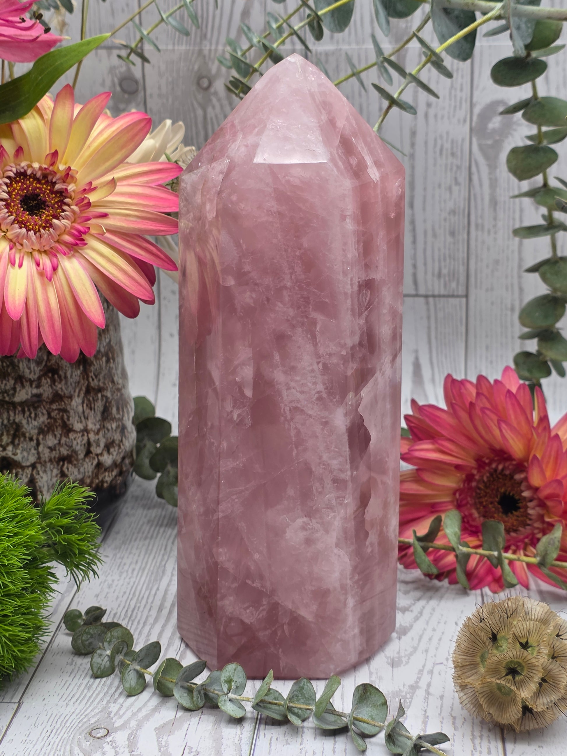 Large rose quartz tower with flowers