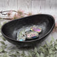 Black ceramic bowl with polished finish