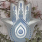 Glass hamsa dish with silver and blue design