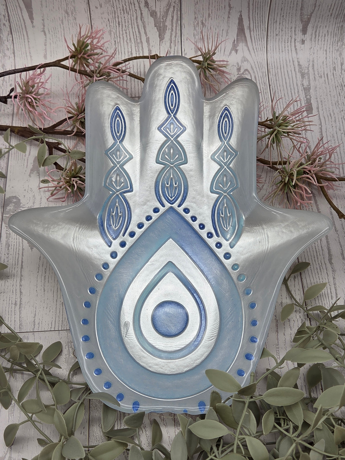 Glass hamsa dish with silver and blue design