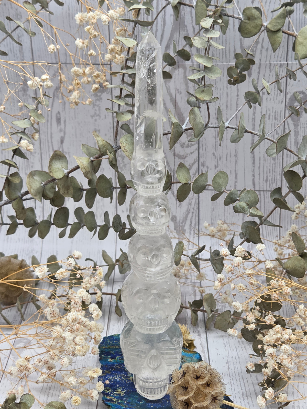 Clear quartz skull wand with stacked skulls
