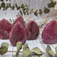 Polished rhodonite mini flames with pink and black colors
