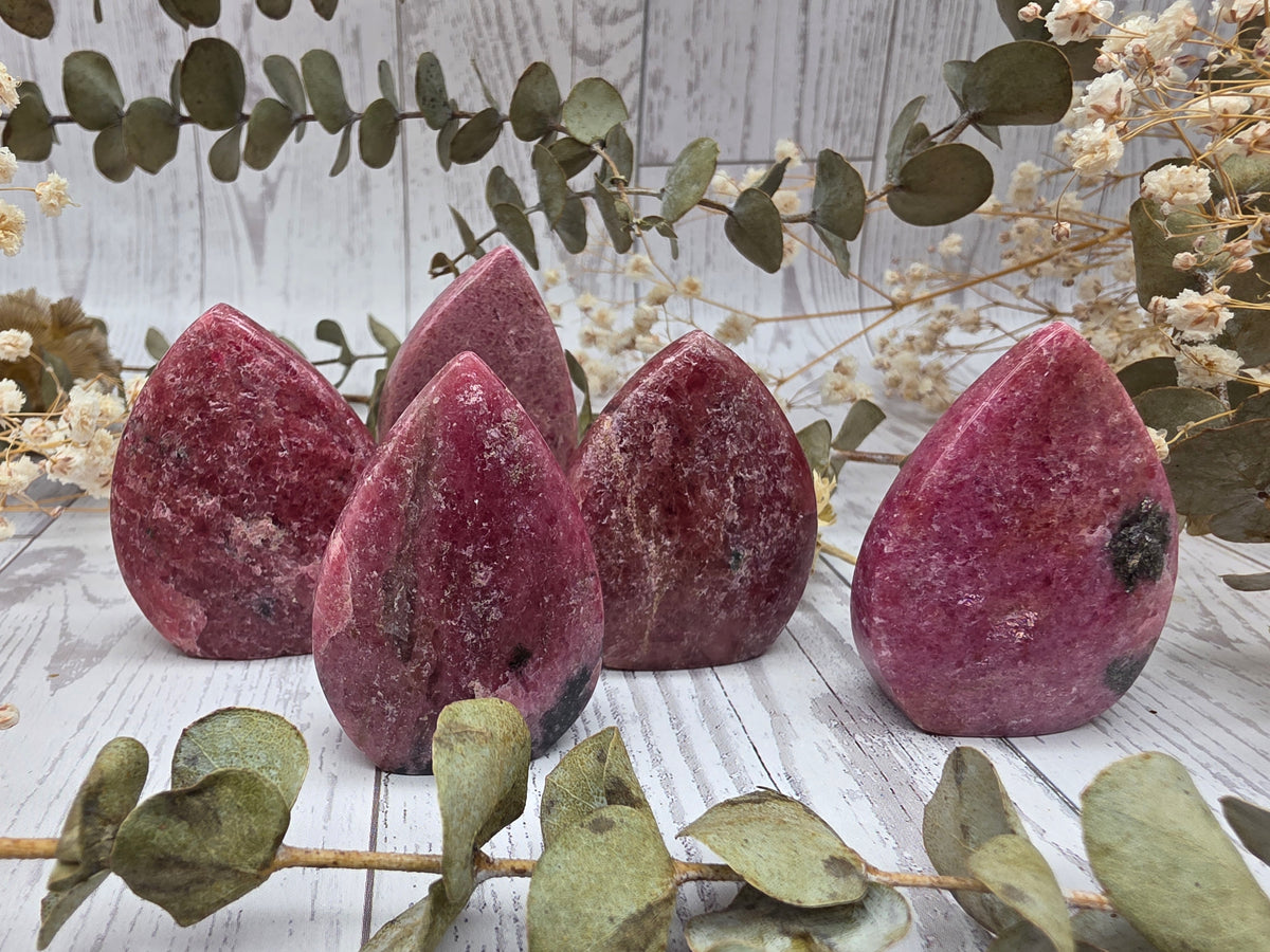 Polished rhodonite mini flames with pink and black colors