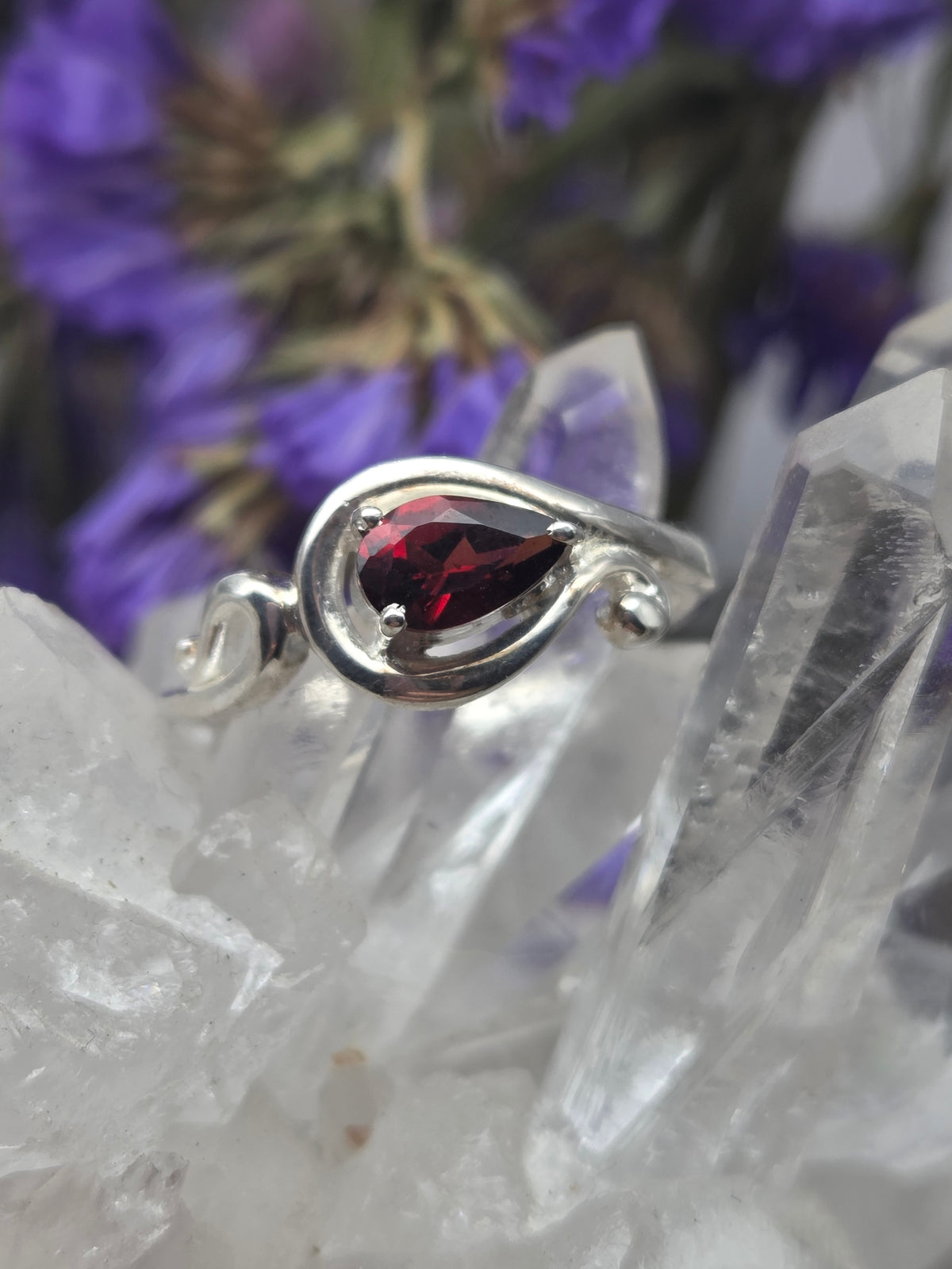 Teardrop garnet ring in sterling silver with a red gemstone