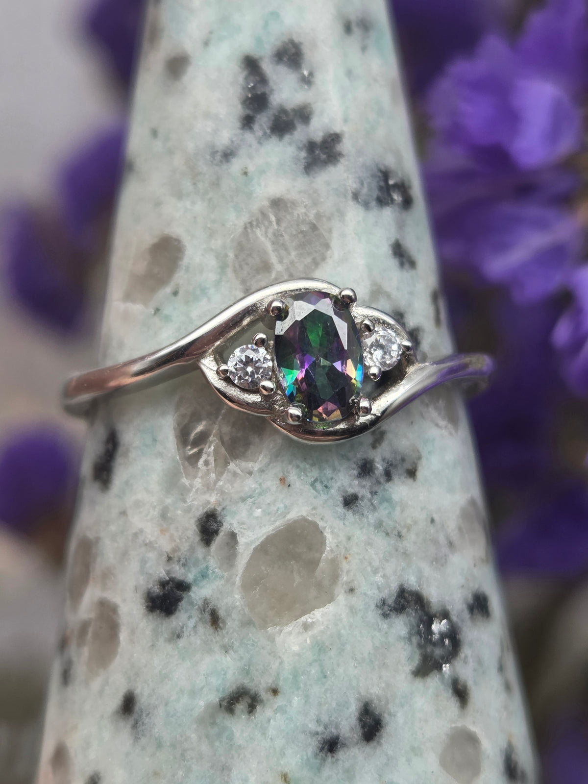 Silver ring with a rainbow-colored and cubic zirconia accents