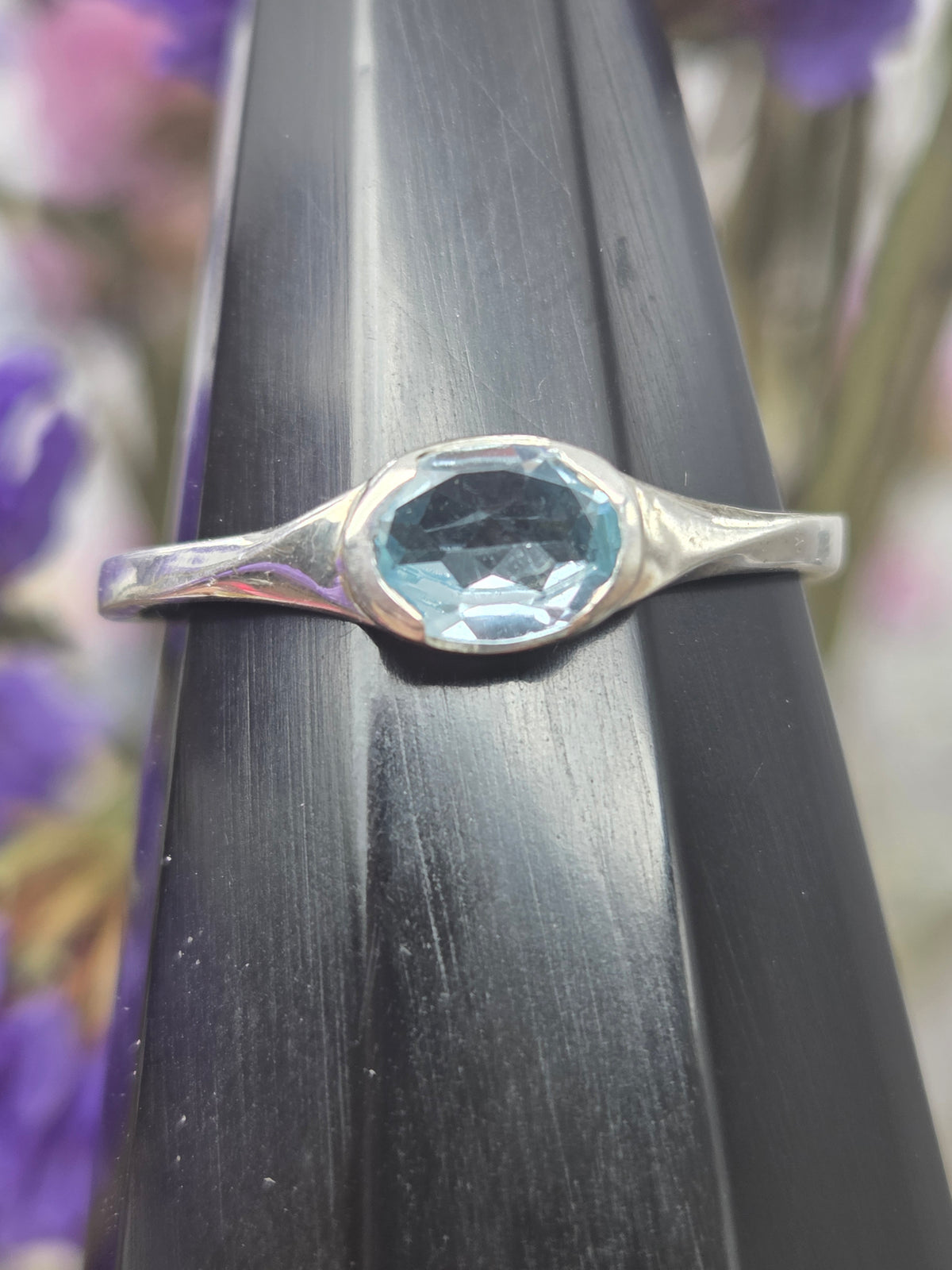 Quartz blue topaz sterling silver ring on display