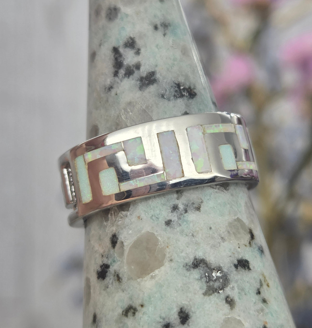 Pink opal sterling silver ring on display