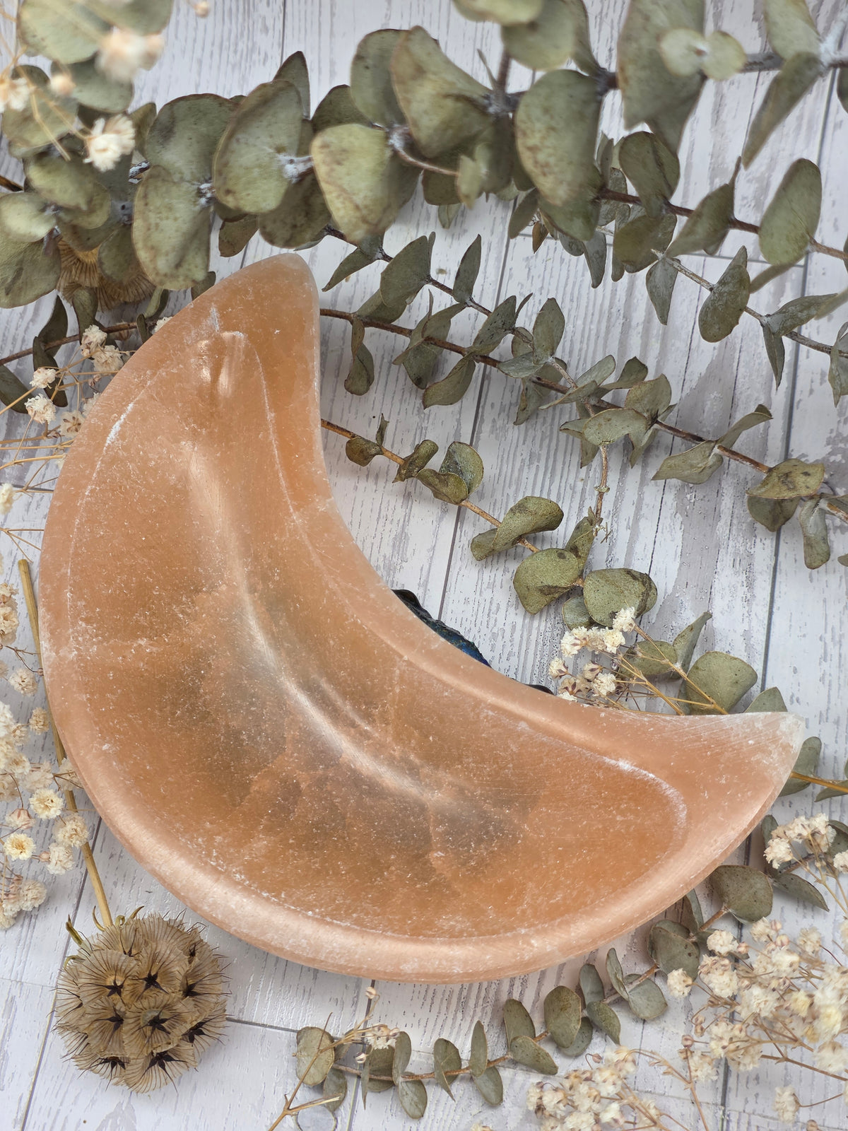 Peach Selenite Moon Bowl with a polished surface
