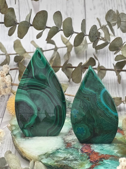 Polished malachite flame with swirling green patterns