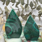 Polished malachite flame with swirling green patterns