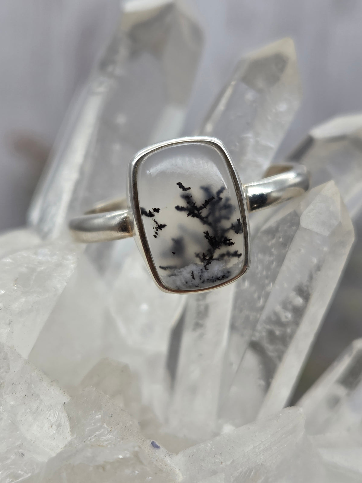 Dendritic opal ring set in sterling silver with black and white patterns