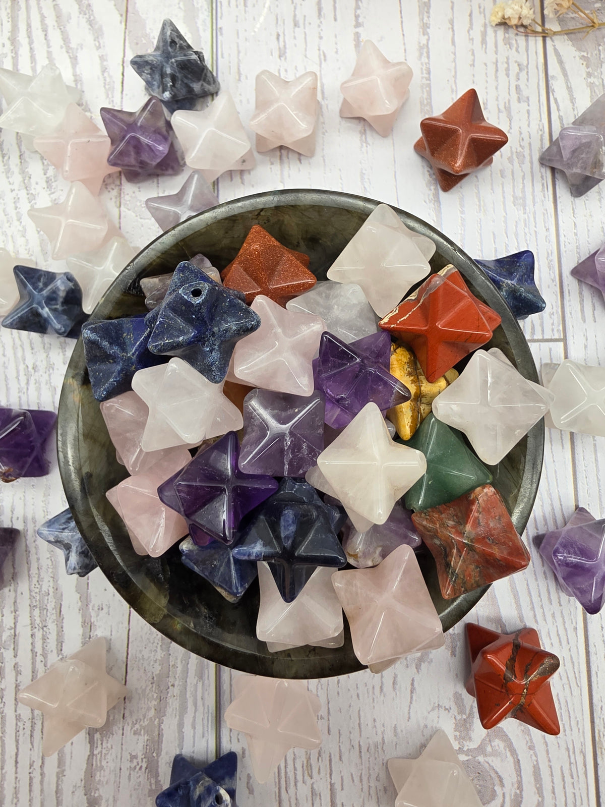 A variety of polished Merkaba stars in different colors