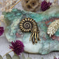 Brass nautilus figurine on a decorative background