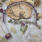 Amethyst headband with purple stones on a wooden background