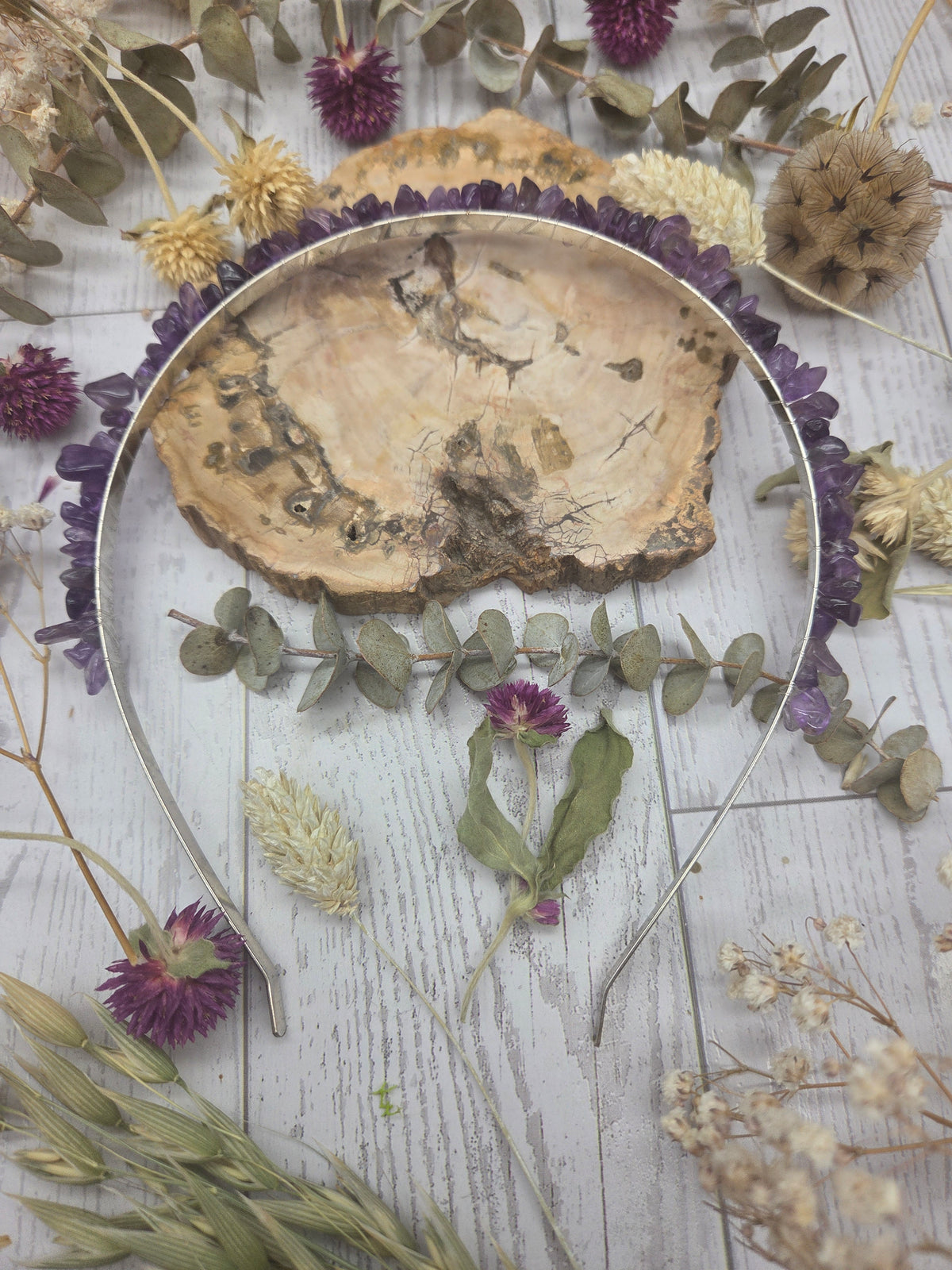 Amethyst headband with purple stones on a wooden background