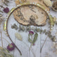 Yellow angel aura quartz and pearl headband on a wooden background