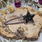 star-shaped crystal barrette on a wooden background