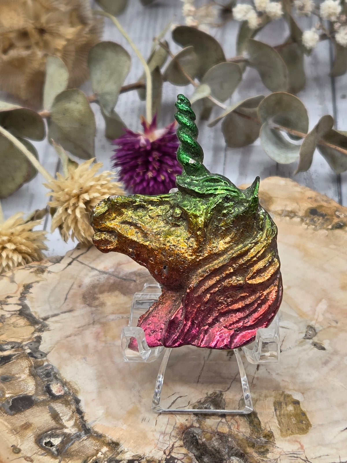 Multicolor Bismuth Unicorn Figurine on a wooden surface