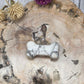 crystal bone carving on a wooden background