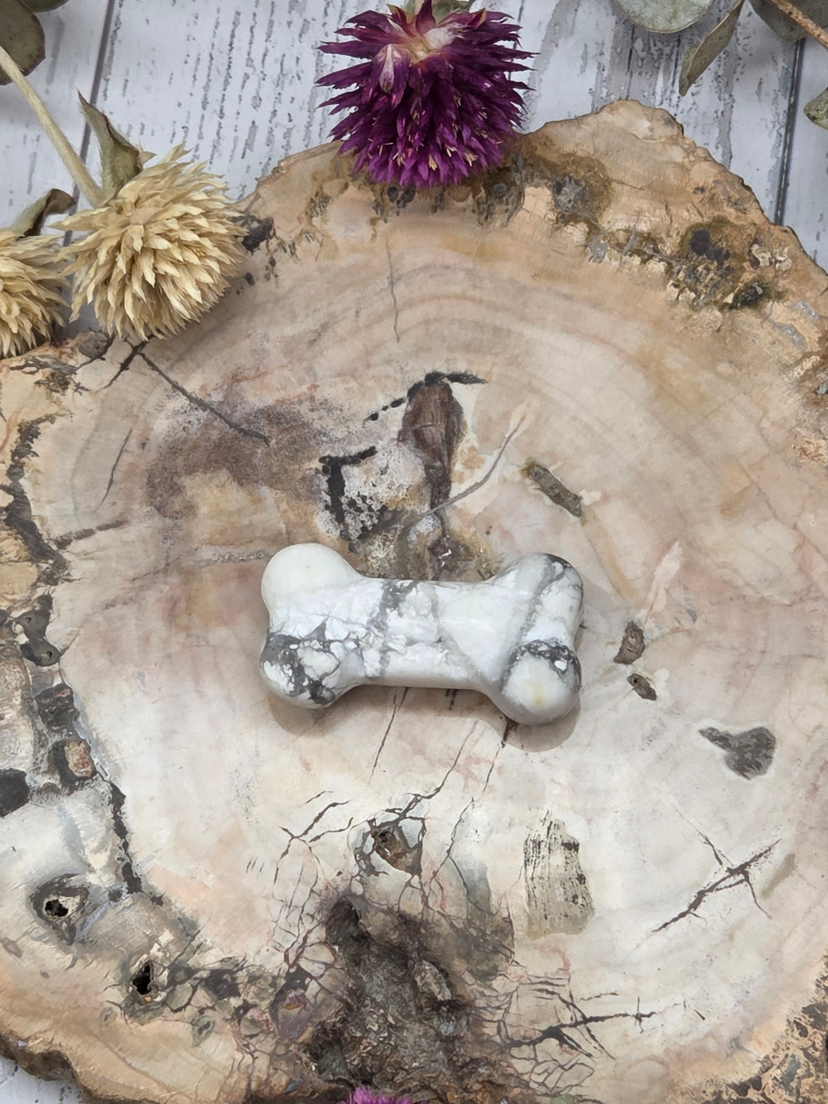 crystal bone carving on a wooden background