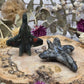 Crystal airplane carving on a wooden base with flowers