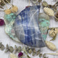 Polished Dumortierite Moon with blue and white patterns