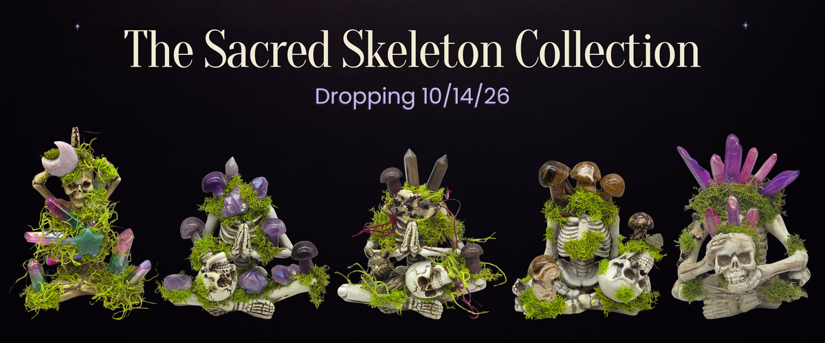 The Sacred Skeleton Collection. Dropping 10/14/26. Five crystal skeleton carvings with purple crystal mushrooms.